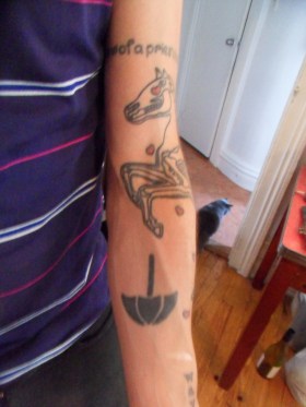 The twins' logo tattooed on Nathan's arm. (Photo: Kristy Ann Muniz)