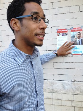 Reynoso and a flyer. (Photo: Nicole Paluska)
