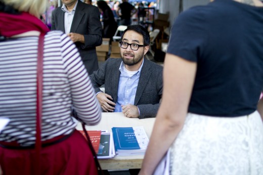 Cartoonist Adrian Tomine signs copies of his series Optic Nerve. (Photo: Meghan White)