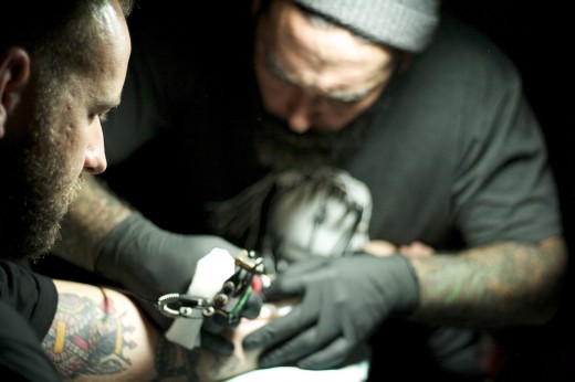 Thompson gets tattooed. (Photo: Nikita Richardson)