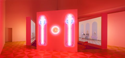 Alex Da Corte (b. 1980) with Jayson Musson (b. 1977). Easternsports, 2014. Four-channel video, color, sound; 152 min., with four screens, neon, carpet, vinyl composition tile, metal folding chairs, artificial oranges, orange scent, and diffusers. Score by Devonté Hynes. Collection of the artists; courtesy David Risley Gallery, Copenhagen, and Salon 94, New York. Installation view, Institute of Contemporary Art, University of Pennsylvania, 2014 © Alex Da Corte; image courtesy the artist and Institute of Contemporary Art, University of Pennsylvania